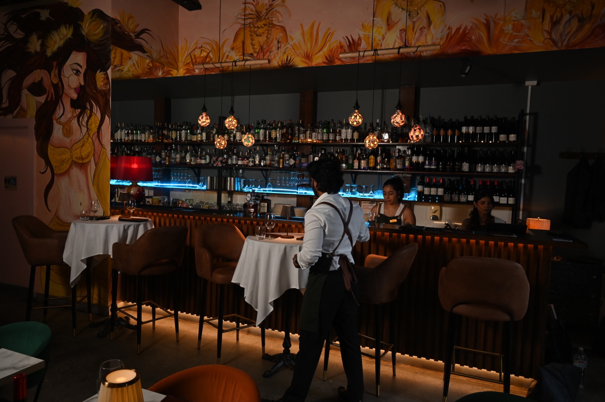 Evening service at the warmly lit Bombay on Bay bar